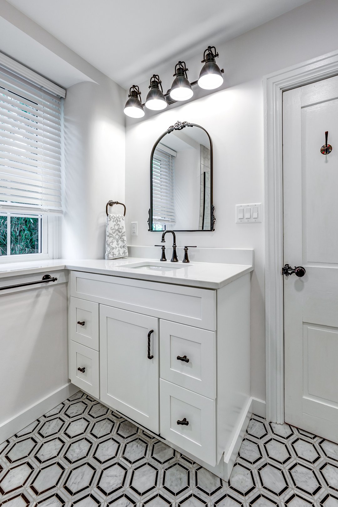 Farmhouse bathroom renovation with modern tile